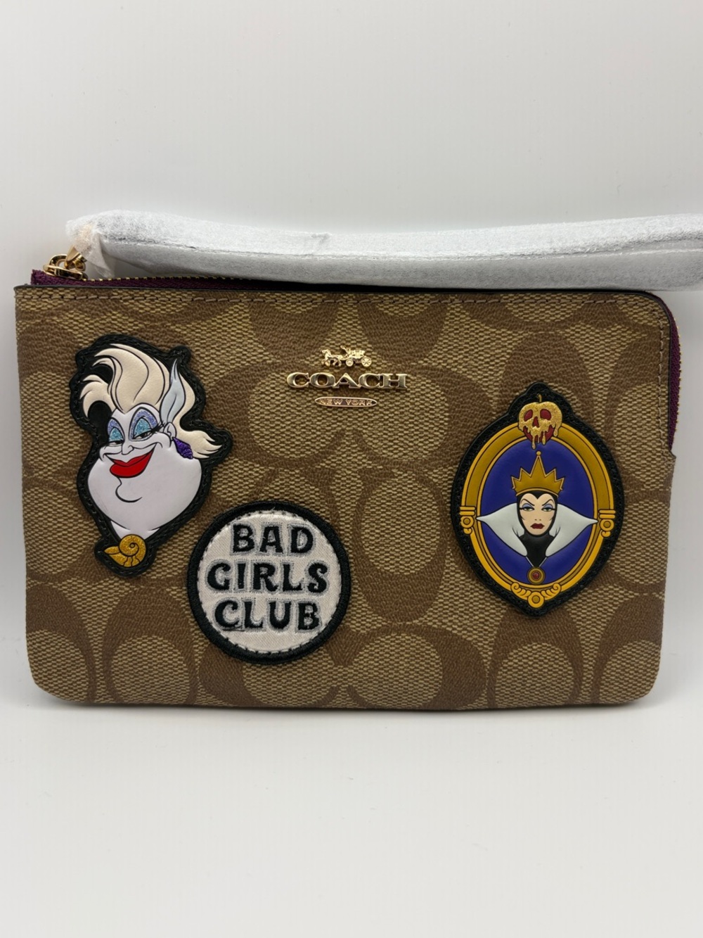 Coach x Disney: “Bad Girls Club”Wristlet with Disney Villain Patches
